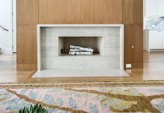 Biophilic rug design in front of fireplace