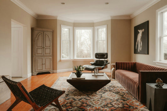 Modern living room design with hardwood floors and Persian rug