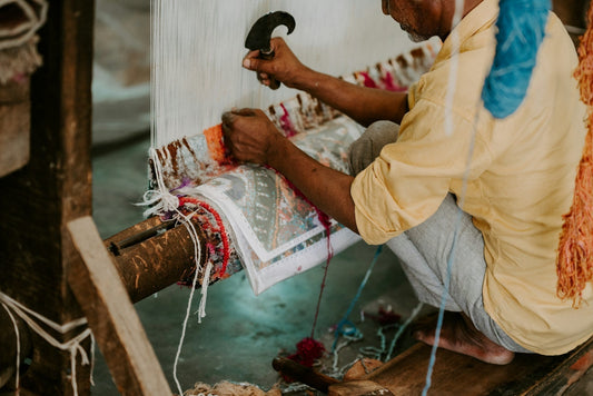 weaver crafting a rug