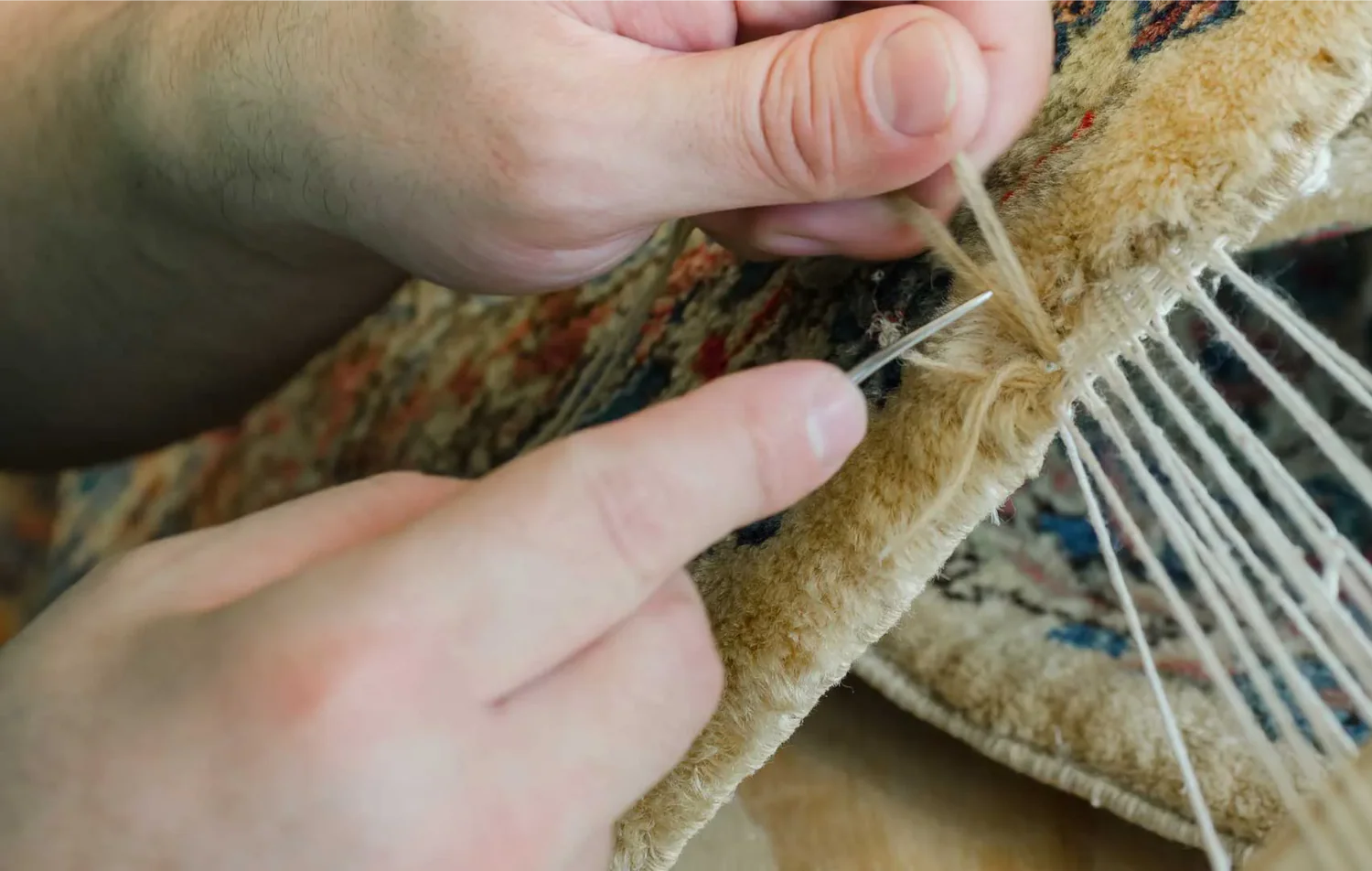 Person repairing oriental rug in Dallas